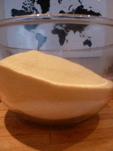 Precariously full bowl of sandy semolina