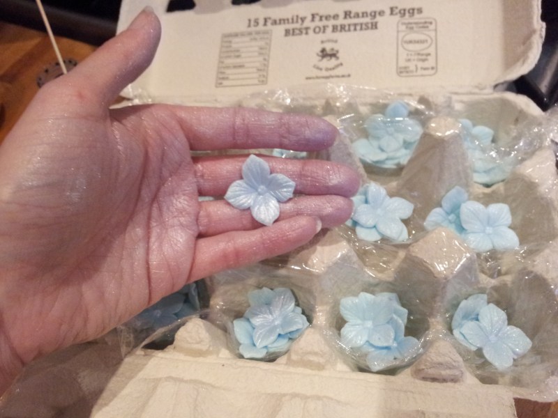 Sticking a milliong sugar flowers in place