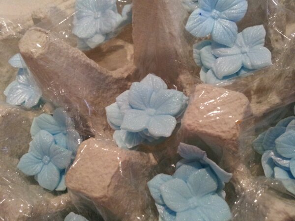 Line an egg box with cling film and pop all your pretty flowers in to hold their shape whilst they dry. Repeat repeat repeat...