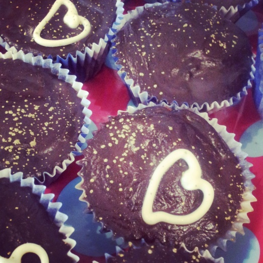 Double chocolate Cupcakes complete with golden lustre, glossy ganache and white chocolate hearts