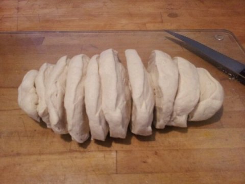 Stage 1. Roll your dough to a sausage shape and cut into 12 equal pieces