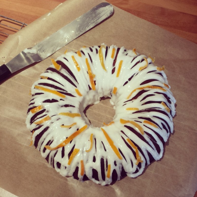 An Armenian Gluten Free Orange Cake with Orange Blossom icing and candied peel