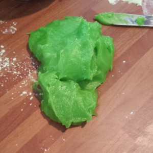The bright green dough scooped safely out of the bowl with a knife
