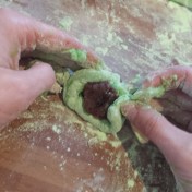 Fold in the edges to seal in the red bean paste