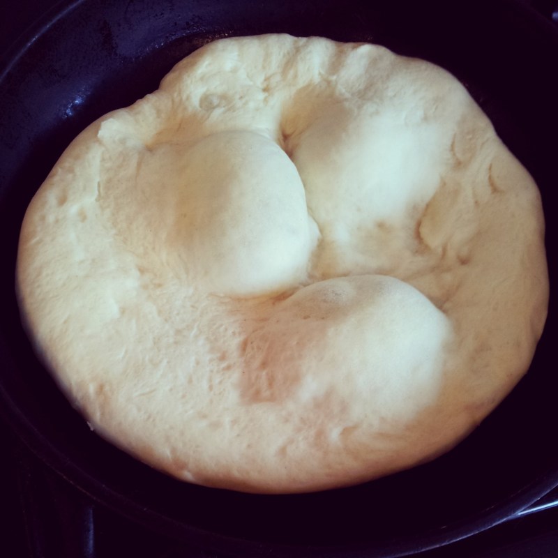 Bazlama hitting the cast iron pan