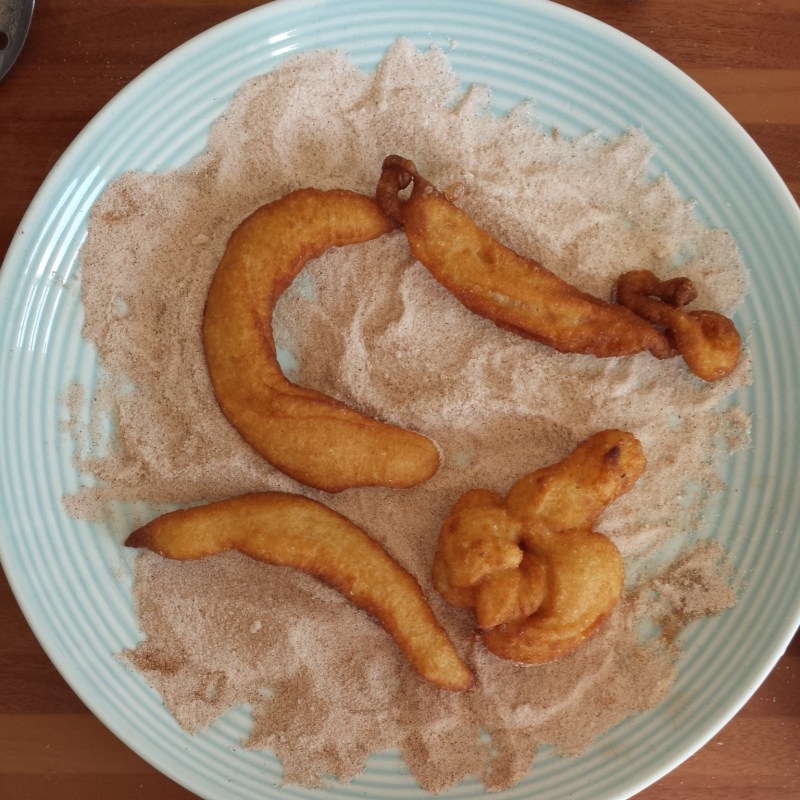 Roll the churros in cinnamon sugar whilst hot