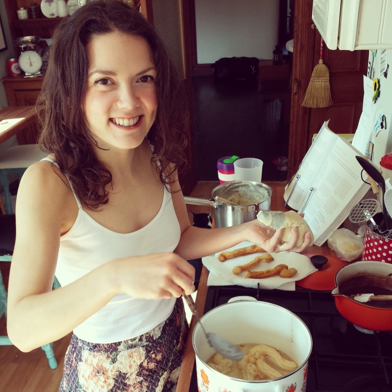 Multi tasking with an upturned piping bag to stop the batter spilling all over the place and flipping the sizzling churros with the other hand