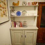 After: The upcycled chalk painted kitchen dresser now with [roper shelves not just a plate rack to house my ever growing collection of cook books